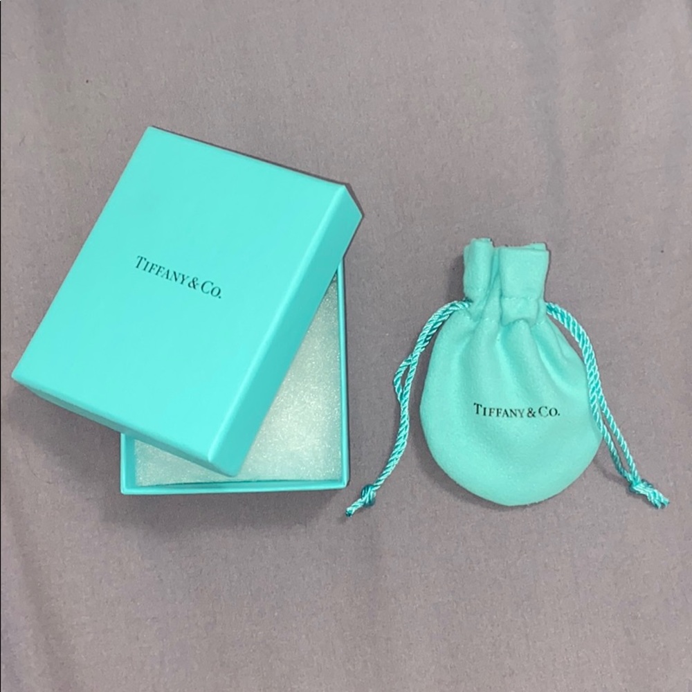 Tiffany & Co. box with dust bag.